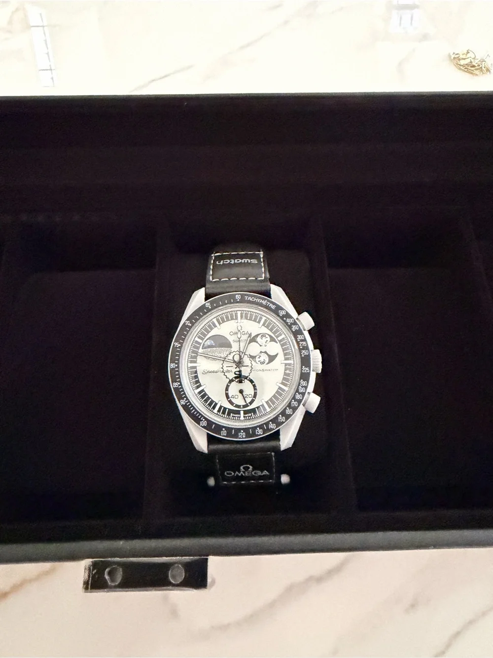 Omega Men's Black and Silver Chronograph Watch
